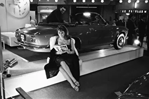 Fur Coat Prints: Model sits beside a Sprint CTC at the British International Motor Show in London 19th
