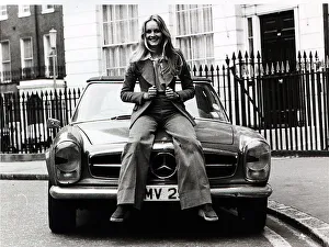 Twiggy Prints: Model, Twiggy, pictured in London sitting on the bonnet of her Mercedes sports car