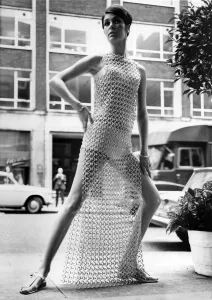 Model Virginia Wonnacott models a deshabille over a bikini with guipure french lace