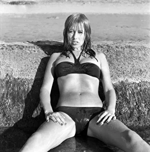 Model wearing a bikini as she poses on a beach in Africa April 1975