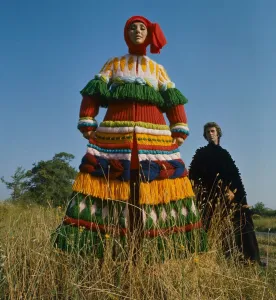 Model wearing a knitted wool Russian styled peasant costume designed by Carosa