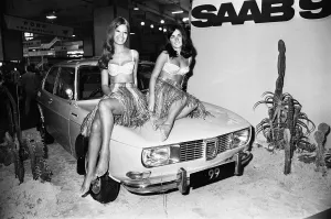 Models drapped over the bonnet of a Saab 99 Motor Car at the 1969 Motor Show 1st June