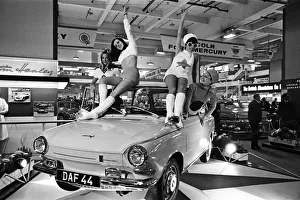 Models drapped over a DAF 44 car at the London Motor Show 18th October 1966