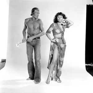 Models pose as a shy couple in the studio August 1977 77-04388-002