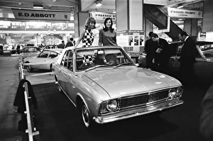 Show Prints: Models posing in this soft top Ford Cortina Mark 2 at the London Motor Show 18th October