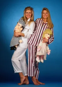 Fashion Clothing Prints: Models wearing mens pyjamas holding Princess Diana and Prince Charles pyjama cases