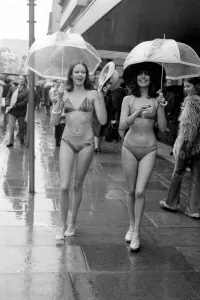 Models Wendy and Jackie seen here modeling the latest in swimwear on a wet Oxford Street