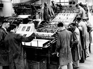 A modern printing press is demonstrated at the London School of Printing