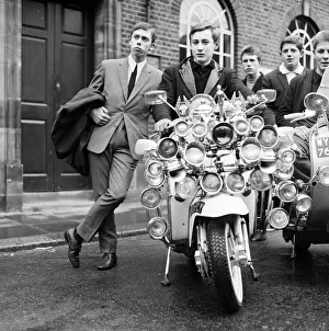 Suits Prints: Mods wearing suits and parkas on Motor Scooters covered with extra lights