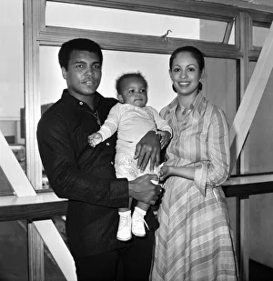 Mohammad Ali pictured with his wife Veronica and baby Hanna at Heathrow Airport today