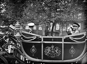 Mohammad-Reza Shah Pahlavi, the Shah of Iran waves to the crowds who turned out to see