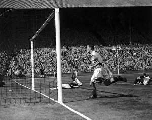 Moir of Bolton on floor scores his teams 2nd goal May 1953 in the Blackpool v
