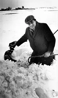 Farmer Prints: Moment of heartbreak for farmer Mr Richard Vaughan as he pulls a dead lamb from a deep