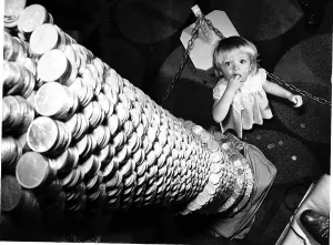 00187 Prints: Money A little girl looks up at the tower of 2p coins 9ft high but is reckoned to contain