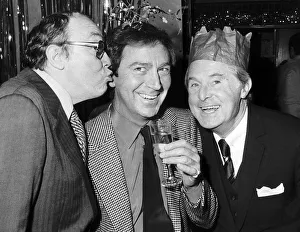 Comedians Prints: Morecambe and Wise with Des O Connor December 1982 sharing some christmas