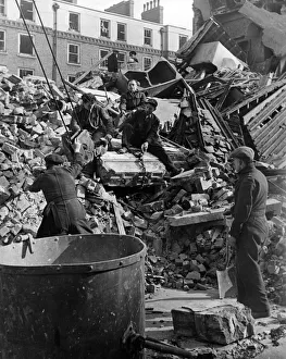 Air Raids Prints: This mornings rescue scene at a block of working class flats in a South West London
