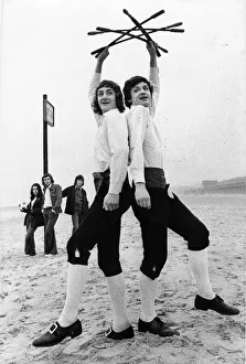 Morris dancing brothers Timothy and Nicholas Bristow practice on the beach at Whitley Bay