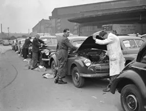 00460 Prints: Morris Minor Low Light Sedans fresh of the production line seen here being prepared for