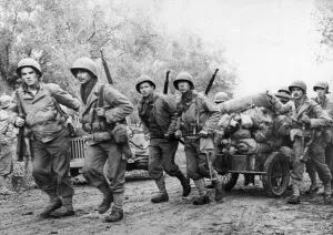 A US mortar team uses a cart to move their equipment in the Venafro sector on the Italian