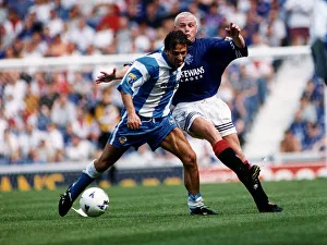Battle Prints: Morton football player Derek McInnes holds off a challenge from Paul Gascoigne of Rangers