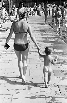 Heat Prints: Mother and child try to keep cool at a Birmingham lido during the summer heatwave of 1976