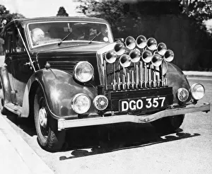 Motoring Prints: Motor Engineer Mr V F Topham of Slough in Buckinghamshire has fitted an organ to