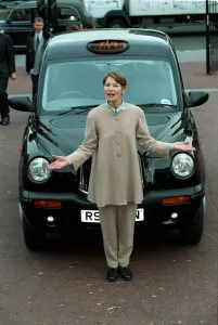00046 Prints: Motor Show October 97 Glenda Jackson junior transport minister standing in front of