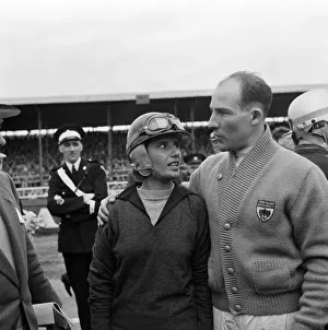 Racing Driver Prints: Motor racing at Silverstone. Stirling Moss expressing his sympathies to Maria Teresa de