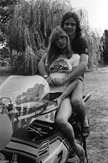 Motorcycle racer Barry Sheene at home with girlfriend 1976 Stephanie McLean sitting