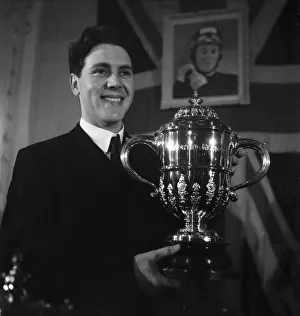 Motorcycling Prints: Motorcycle racing champion Geoff Duke with the World Championship trophy