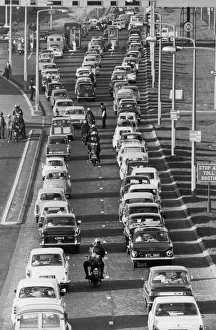 Congestion Prints: Motorists queue up to pay their toll fee at the Dartford Tunnel as they return home