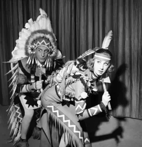 Moyra Fraser and Max Adnan seen as red indians in the London Stage Show