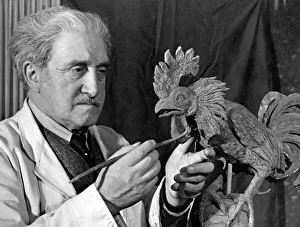 00209 Prints: Mr. Benno Elkan, with his statuette, which is being presented by Arsenal to Tottenham