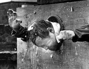 Trapped Prints: Mr Doug Chapman of the Hastings Arms, Seaton Delaval in the stocks for charity on 31st