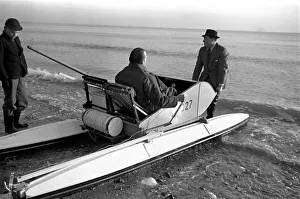 00020 Prints: Mr. Du - Preaine setting out on crop channel trip in pedal boat. January 1953 D437-003