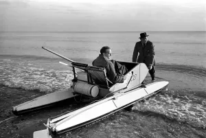 00021 Prints: Mr. Du - Preaine setting out on crop channel trip in pedal boat. January 1953 D437-002