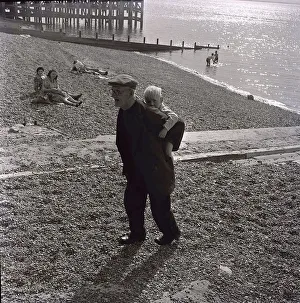 Carrying Prints: Mr G. A. B. Warner an Oyster fisherman from Whitstable in Kent takes his grandson for a