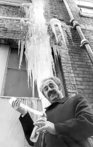 Mr. Home Michaeides stirs his gin and tonic with an ice spar as he prepares to drink a
