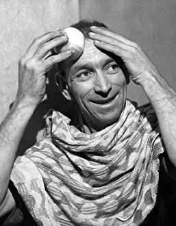 00151 Prints: Mr John Harris of Cardiff tries an onion rub on his bald patches to encourage growth of