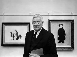 Mr Ls Lowry made a freeman of Salford. Mr Lowry stands between to of his early paintings