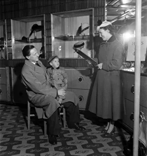Parents Prints: Mr and Mr Ken Keyser and son Graham- she is trying on hats for husbands approval