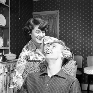 Mr. and Mrs. Health seen here at home discussing how he proposed marriage to her