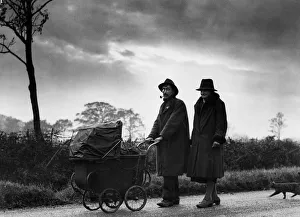 Pram Prints: Mr and Mrs Smith on the road being followed by a cat. 19th November 1934