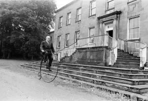 00481 Prints: Mr Philip Yorke takes a trip around the grounds of his house on a Penny Farthing