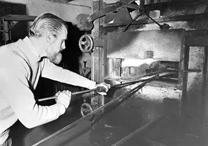 Mr. Reg Wilkinson concentrates on the production of stained glass at Hartley Wood