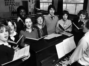 Grammar School Prints: Mr Stuart Nash (at the piano) with principal singers in the Hodge Hill Girl