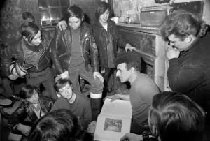 Mr. Ted Wood of Birch, near Manchester reads the Bible to Hell Angels Club during a