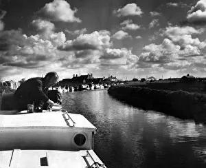 Painting Prints: Mr Willian Ball preparing his cabin cruiser for a trip along the Leeds