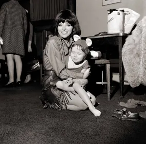 Woman And Child Prints: Mrs Anthony Newley (actress Joan Collins) this afternoon was acting as dresser to her 5