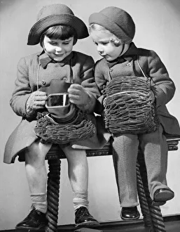 Mrs Burrows makes useful gas mask cases for her daughters during the Second World War